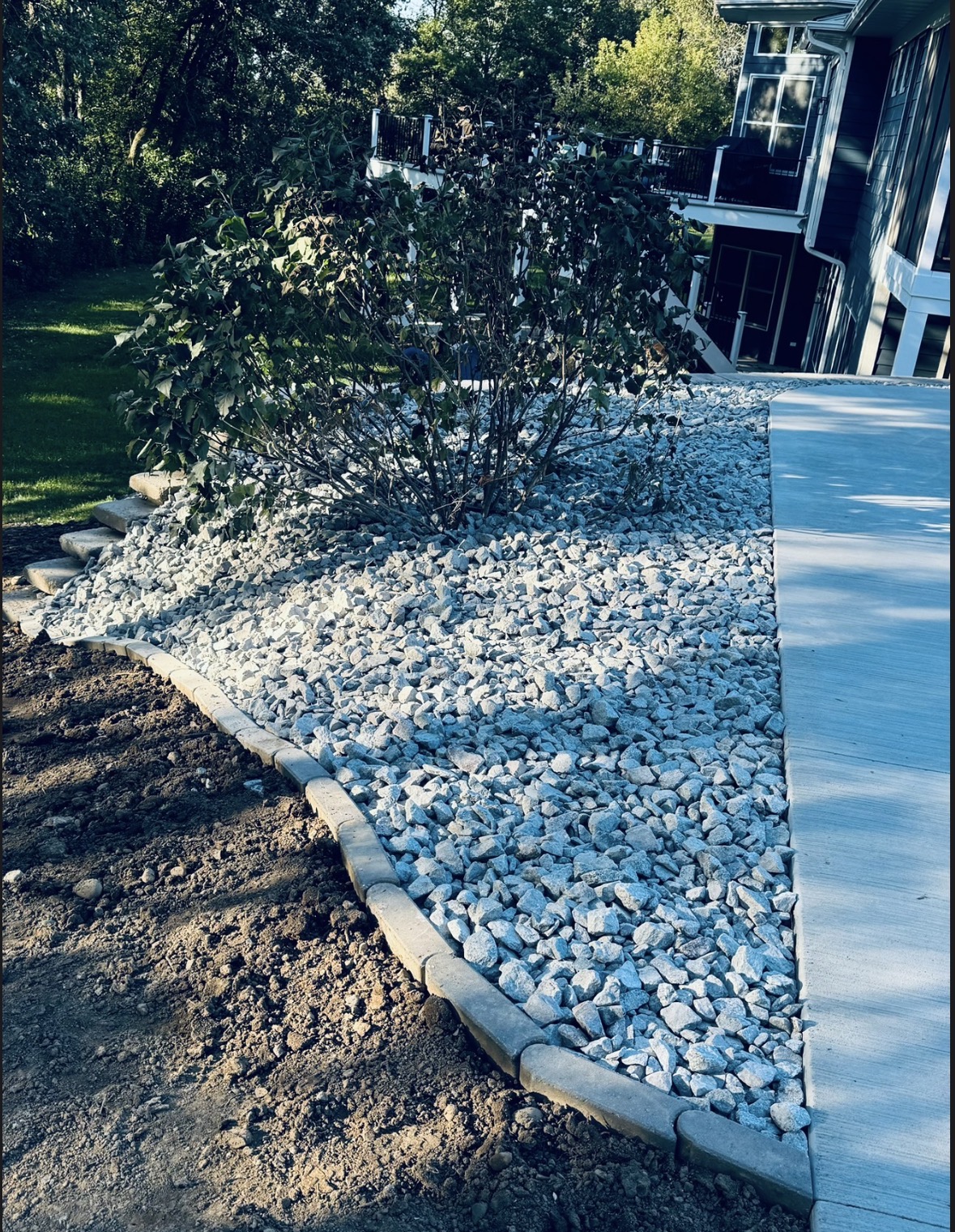 Rock bed with paver edging